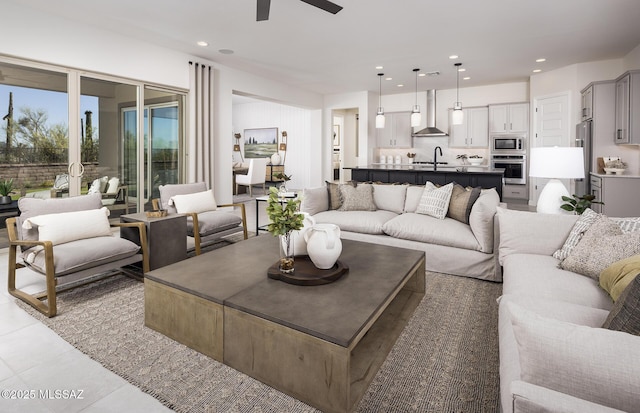 living room with a ceiling fan, light tile patterned floors, and recessed lighting