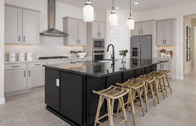kitchen with wall chimney range hood, stainless steel appliances, decorative backsplash, light tile patterned floors, and recessed lighting