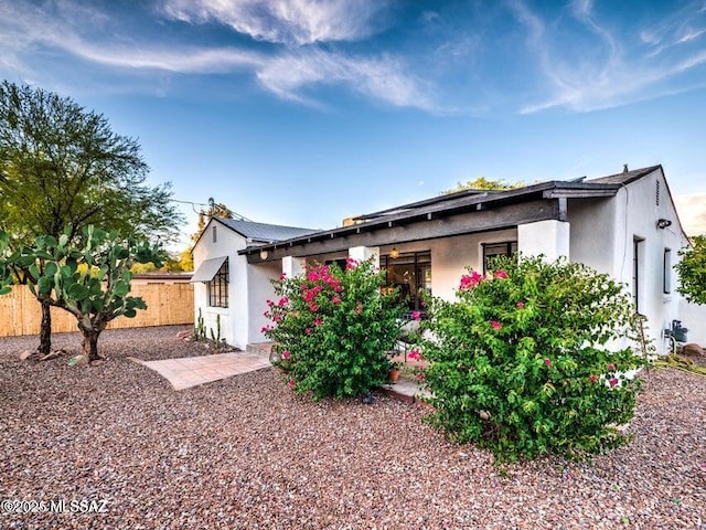 1700 N Winstel Blvd, Tucson, AZ 85716 - view of front facade featuring fence and stucco siding