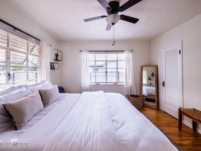 1700 N Winstel Blvd, Tucson, AZ 85716 - bedroom featuring wood finished floors, a ceiling fan, and baseboards
