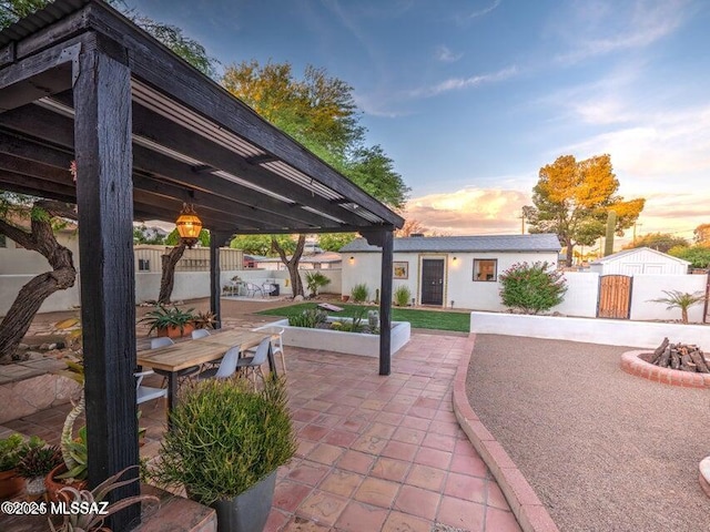 1700 N Winstel Blvd, Tucson, AZ 85716 - view of patio featuring an outdoor fire pit and outdoor dining space
