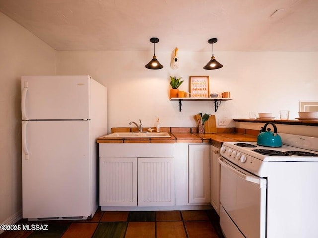1700 N Winstel Blvd, Tucson, AZ 85716 - kitchen featuring white appliances, a sink, open shelves, hanging light fixtures, and light countertops