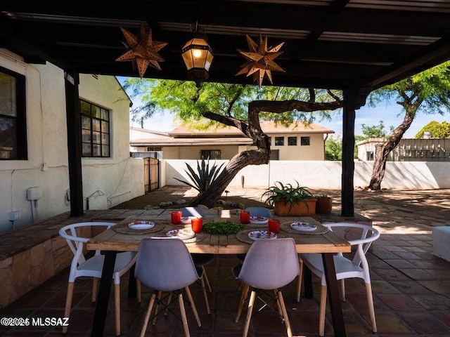1700 N Winstel Blvd, Tucson, AZ 85716 - view of patio with fence and outdoor dining space