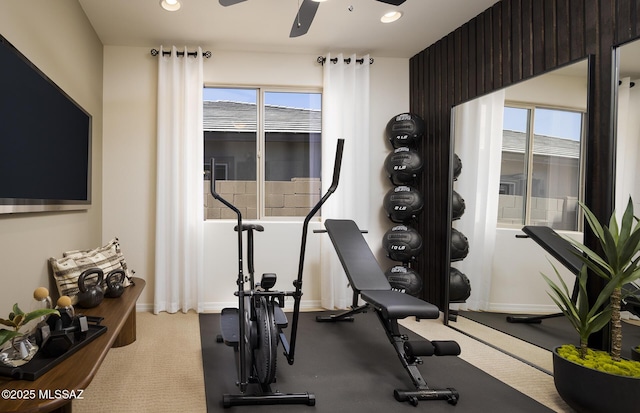 exercise room with baseboards, a ceiling fan, and recessed lighting