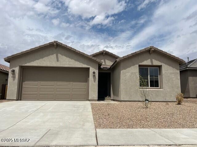 14385 N Saguaro Nest Trl, Marana, AZ 85658 - ranch-style home with stucco siding, an attached garage, and driveway