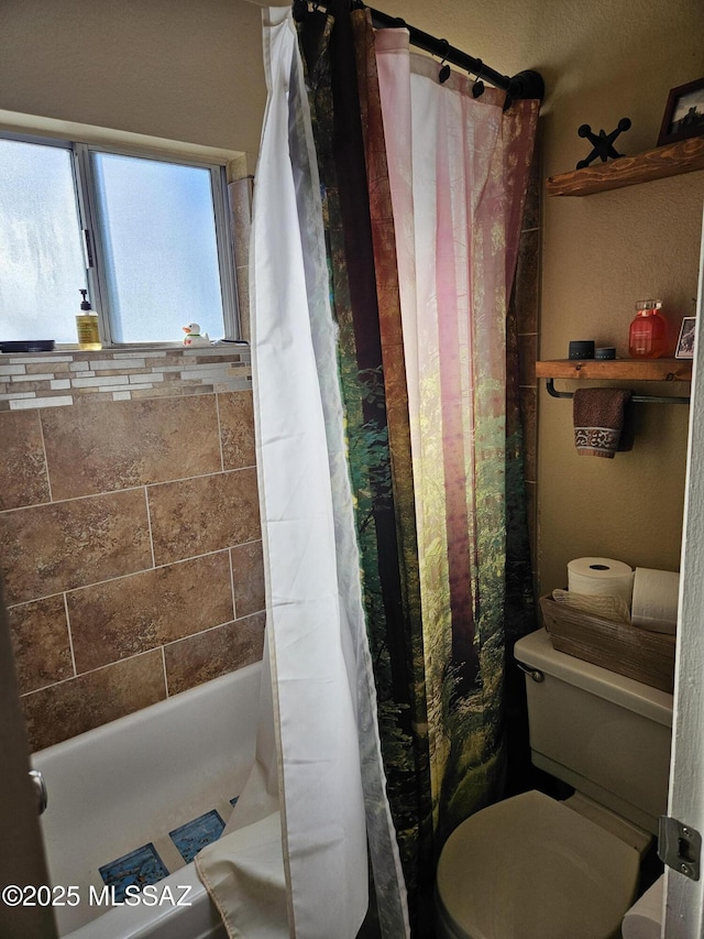 bathroom with curtained shower and toilet