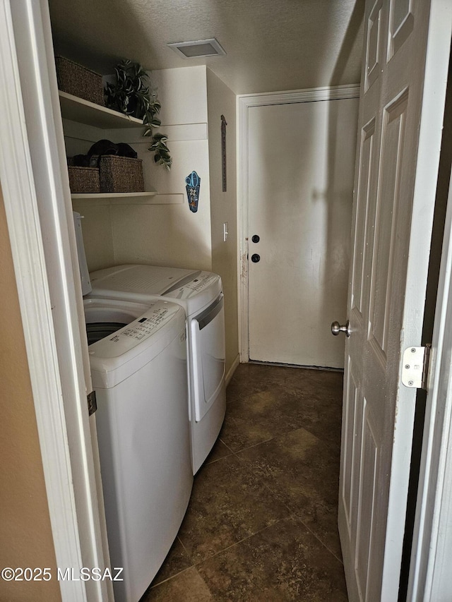 clothes washing area with independent washer and dryer