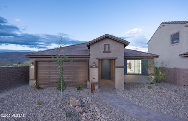 13478 E Silverra Pl, Tucson, AZ 85747 - ranch-style house featuring stucco siding, a garage, fence, and driveway