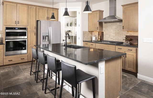 13478 E Silverra Pl, Tucson, AZ 85747 - kitchen featuring wall chimney range hood, a sink, decorative backsplash, a breakfast bar, and stainless steel appliances