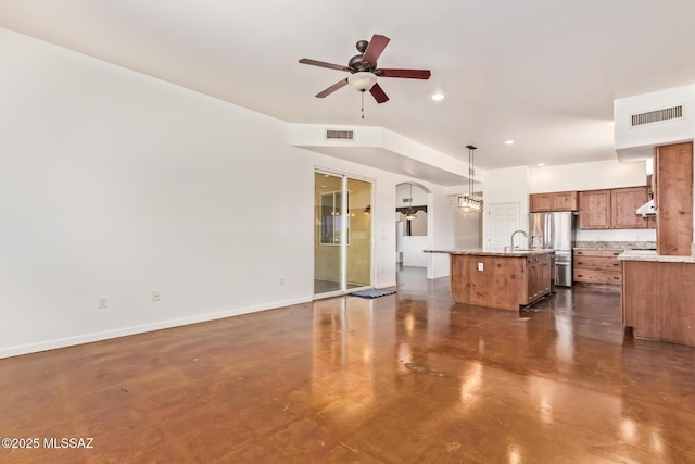13940 E Hay Bale Trl, Vail, AZ 85641 - unfurnished living room with finished concrete flooring, ceiling fan, a sink, recessed lighting, and baseboards