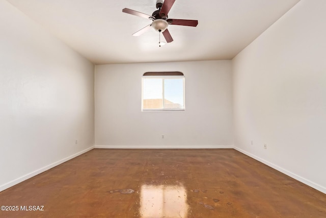 13940 E Hay Bale Trl, Vail, AZ 85641 - spare room with baseboards, concrete floors, and a ceiling fan