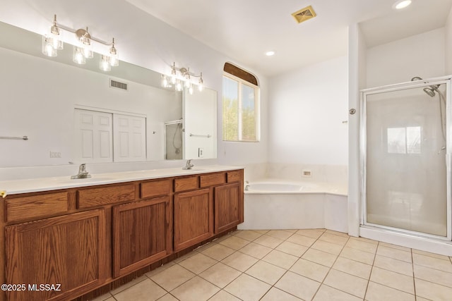 13940 E Hay Bale Trl, Vail, AZ 85641 - full bath featuring a shower stall, double vanity, a garden tub, tile patterned floors, and recessed lighting