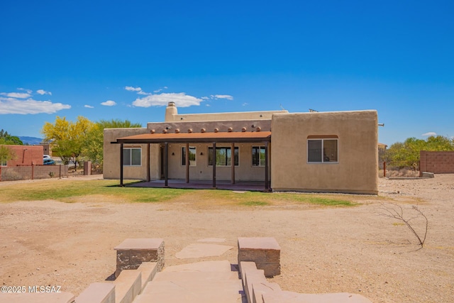 13940 E Hay Bale Trl, Vail, AZ 85641 - back of property with a patio area, fence, and stucco siding
