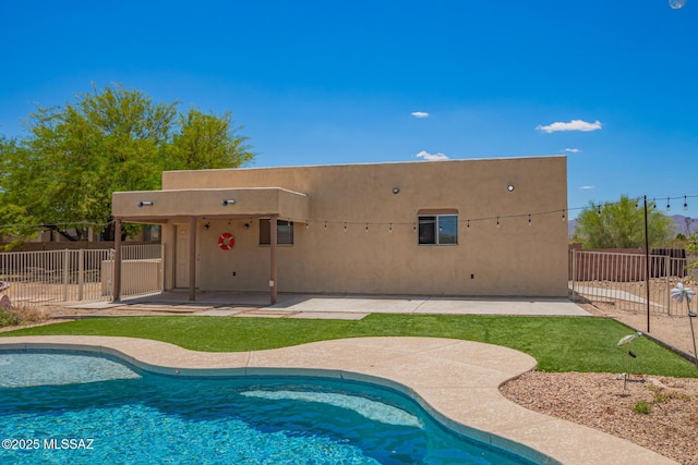 13940 E Hay Bale Trl, Vail, AZ 85641 - back of property featuring stucco siding, a patio, and fence