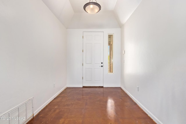 13940 E Hay Bale Trl, Vail, AZ 85641 - foyer entrance featuring concrete flooring, vaulted ceiling, and baseboards
