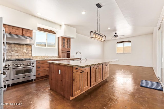 13940 E Hay Bale Trl, Vail, AZ 85641 - kitchen with high end stove, brown cabinets, finished concrete flooring, and recessed lighting