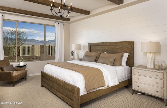 carpeted bedroom with beam ceiling, a chandelier, and a mountain view