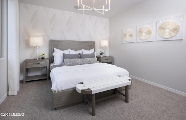 bedroom with carpet, a chandelier, and baseboards
