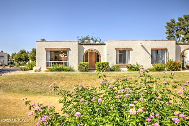957 N Camino Las Solanas, Tucson, AZ 85710 - mediterranean / spanish-style house with stucco siding and a front lawn