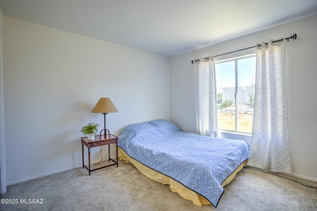 957 N Camino Las Solanas, Tucson, AZ 85710 - carpeted bedroom featuring baseboards
