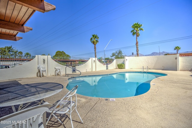 957 N Camino Las Solanas, Tucson, AZ 85710 - view of swimming pool featuring a fenced backyard, a patio, and a mountain view