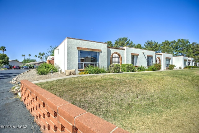 957 N Camino Las Solanas, Tucson, AZ 85710 - mediterranean / spanish-style home with stucco siding and a front yard