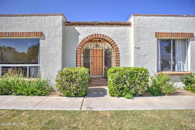 957 N Camino Las Solanas, Tucson, AZ 85710 - view of exterior entry featuring stucco siding