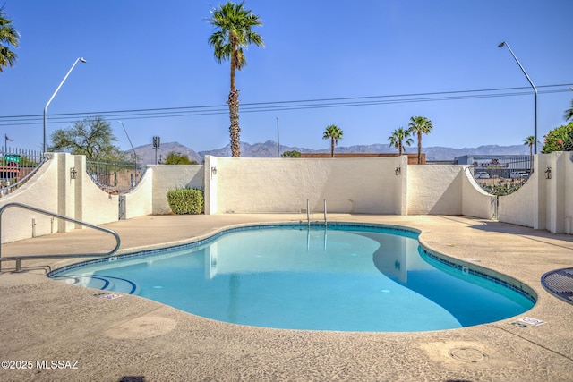 957 N Camino Las Solanas, Tucson, AZ 85710 - community pool with a mountain view and a patio area
