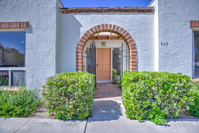 957 N Camino Las Solanas, Tucson, AZ 85710 - doorway to property featuring stucco siding