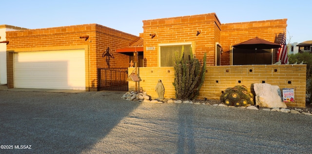 5800 N Placita Esplendora, Tucson, AZ 85718 - view of front of property featuring asphalt driveway, an attached garage, and fence