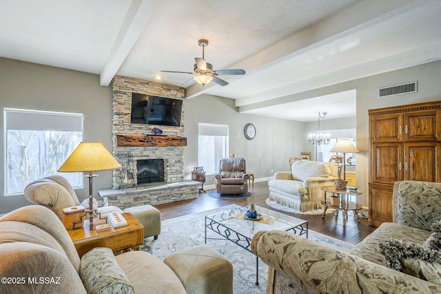 5800 N Placita Esplendora, Tucson, AZ 85718 - living area featuring beam ceiling, ceiling fan, wood finished floors, a fireplace, and a chandelier
