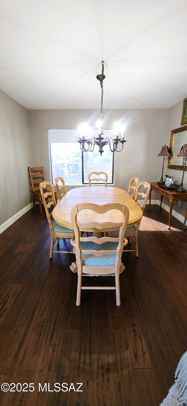 5800 N Placita Esplendora, Tucson, AZ 85718 - dining room with dark wood-style floors, a chandelier, and baseboards