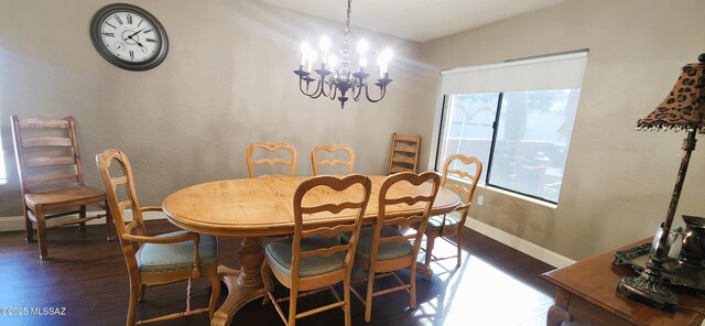5800 N Placita Esplendora, Tucson, AZ 85718 - dining area with dark wood finished floors, a chandelier, and baseboards