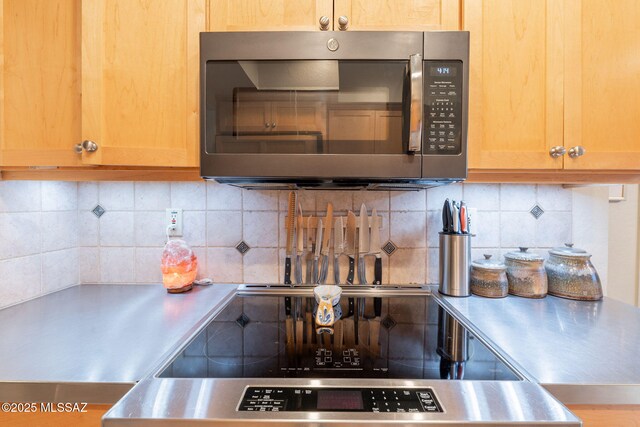 5800 N Placita Esplendora, Tucson, AZ 85718 - kitchen featuring stainless steel counters, stainless steel microwave, decorative backsplash, and stove