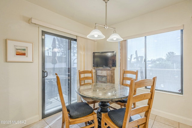 5800 N Placita Esplendora, Tucson, AZ 85718 - dining area featuring light tile patterned floors and baseboards
