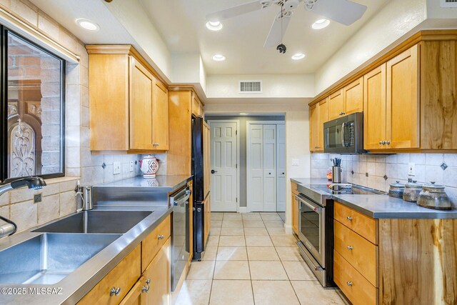 5800 N Placita Esplendora, Tucson, AZ 85718 - kitchen featuring electric stove, black microwave, stainless steel countertops, a sink, and a ceiling fan