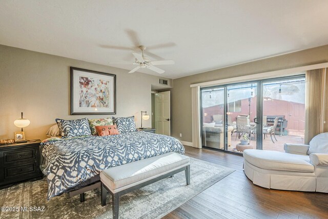 5800 N Placita Esplendora, Tucson, AZ 85718 - bedroom with access to exterior, wood finished floors, and a ceiling fan