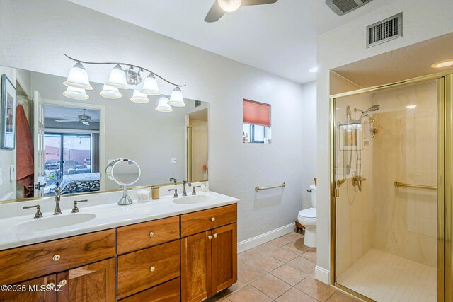 5800 N Placita Esplendora, Tucson, AZ 85718 - ensuite bathroom featuring a ceiling fan, toilet, a shower stall, and tile patterned floors