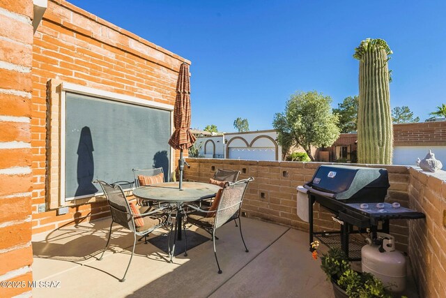 5800 N Placita Esplendora, Tucson, AZ 85718 - view of patio featuring outdoor dining area, fence, and a grill