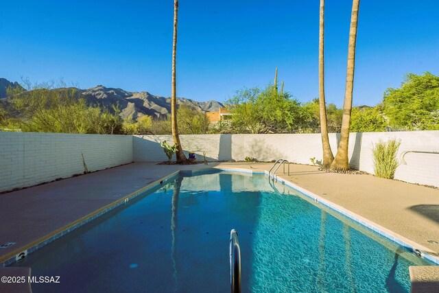 5800 N Placita Esplendora, Tucson, AZ 85718 - view of swimming pool with a mountain view, a fenced backyard, and a patio