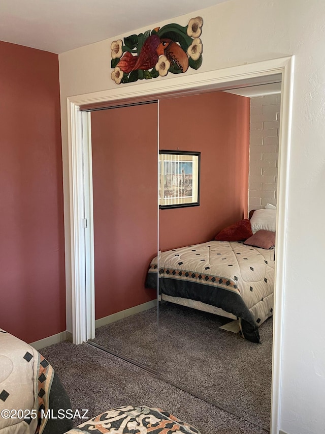360 W Camino Del Sonador, Green Valley, AZ 85614 - bedroom featuring carpet floors, a closet, and baseboards