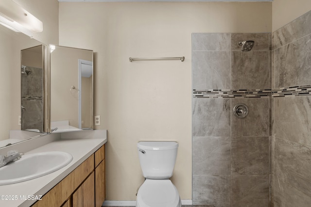 4765 S Windrose Dr, Tucson, AZ 85730 - bathroom with a tile shower, vanity, and toilet