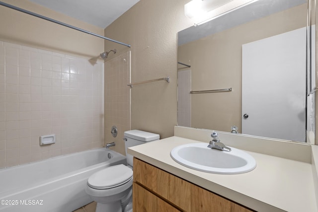 4765 S Windrose Dr, Tucson, AZ 85730 - bathroom featuring toilet, vanity, and washtub / shower combination