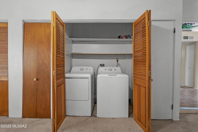 4765 S Windrose Dr, Tucson, AZ 85730 - laundry area featuring light colored carpet and separate washer and dryer