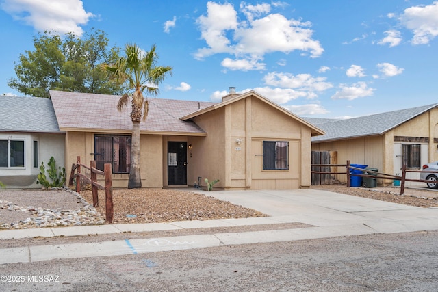 4765 S Windrose Dr, Tucson, AZ 85730 - ranch-style home featuring fence, a shingled roof, and stucco siding