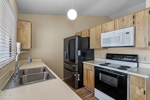 4765 S Windrose Dr, Tucson, AZ 85730 - kitchen with white appliances, a sink, light countertops, lofted ceiling, and light wood-style floors