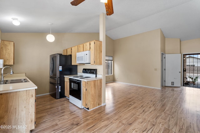 4765 S Windrose Dr, Tucson, AZ 85730 - kitchen featuring electric stove, white microwave, a sink, light wood-style flooring, and high vaulted ceiling