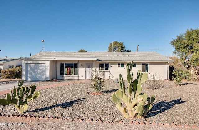 6001 E Sylvane St, Tucson, AZ 85711 - ranch-style house with a garage and concrete driveway