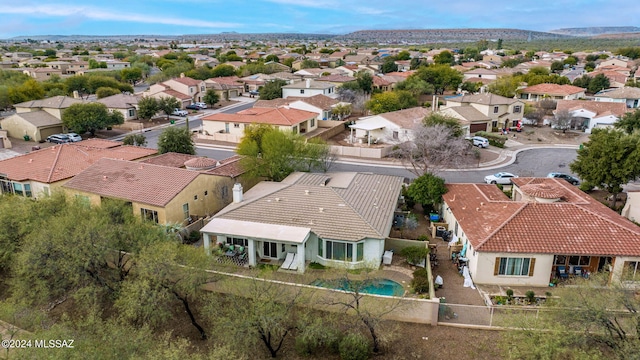 15083 S Placita Rancho Verano, Sahuarita, AZ 85629 - aerial perspective of suburban area featuring a pool and a mountain backdrop