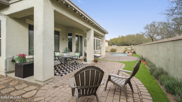 15083 S Placita Rancho Verano, Sahuarita, AZ 85629 - view of patio / terrace with a fenced backyard and outdoor dining space